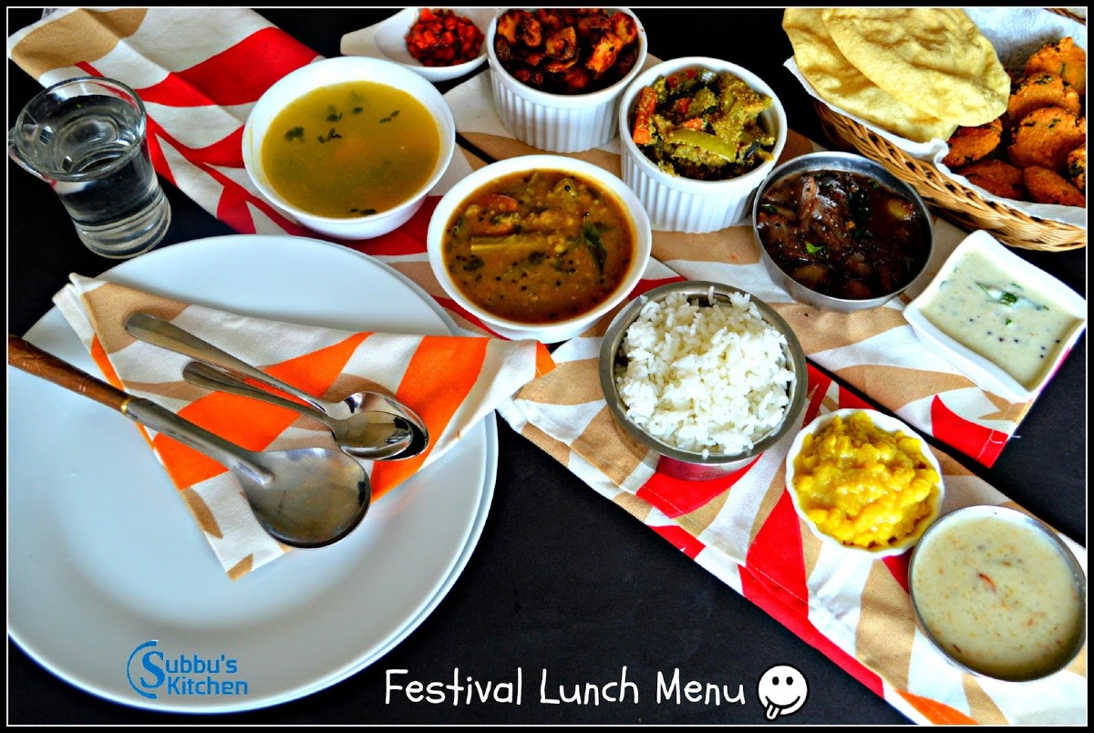 A lavish South Indian vegetarian festival lunch menu served on a traditional banana leaf, featuring a variety of dishes like steaming white rice, sambar, rasam, kootu, poriyal, vadai, appalam, and a selection of pickles, along with payasam for dessert, beautifully arranged and garnished with fresh curry leaves.