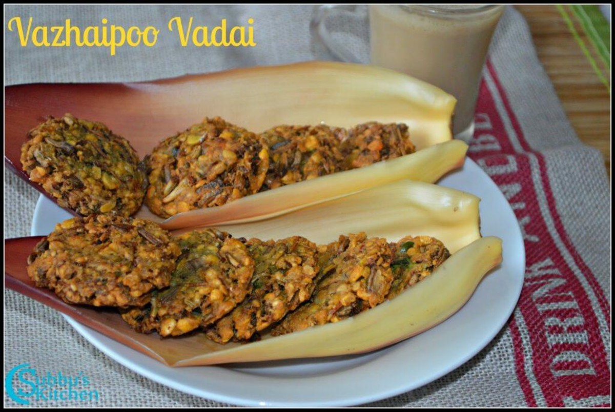 A plate of golden-brown vazhaipoo vada, crispy on the outside and soft inside, served with fresh curry leaves and a side of coconut chutney.