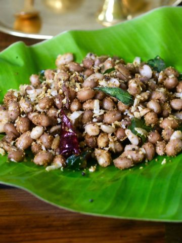 South Indian Peanut Sundal served in a bowl, garnished with fresh coconut and curry leaves