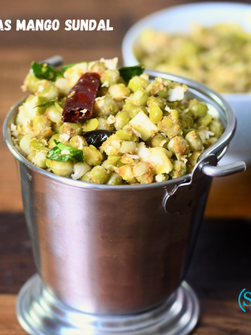 A bowl of Peas Mango Sundal (Pattani Sundal) garnished with grated coconut and raw mango, a traditional South Indian festival snack.