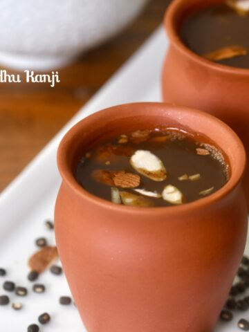 Traditional South Indian Ulundhu Kanji (Urad Dal Porridge) served in a bowl, garnished with spices and a smooth, creamy texture.