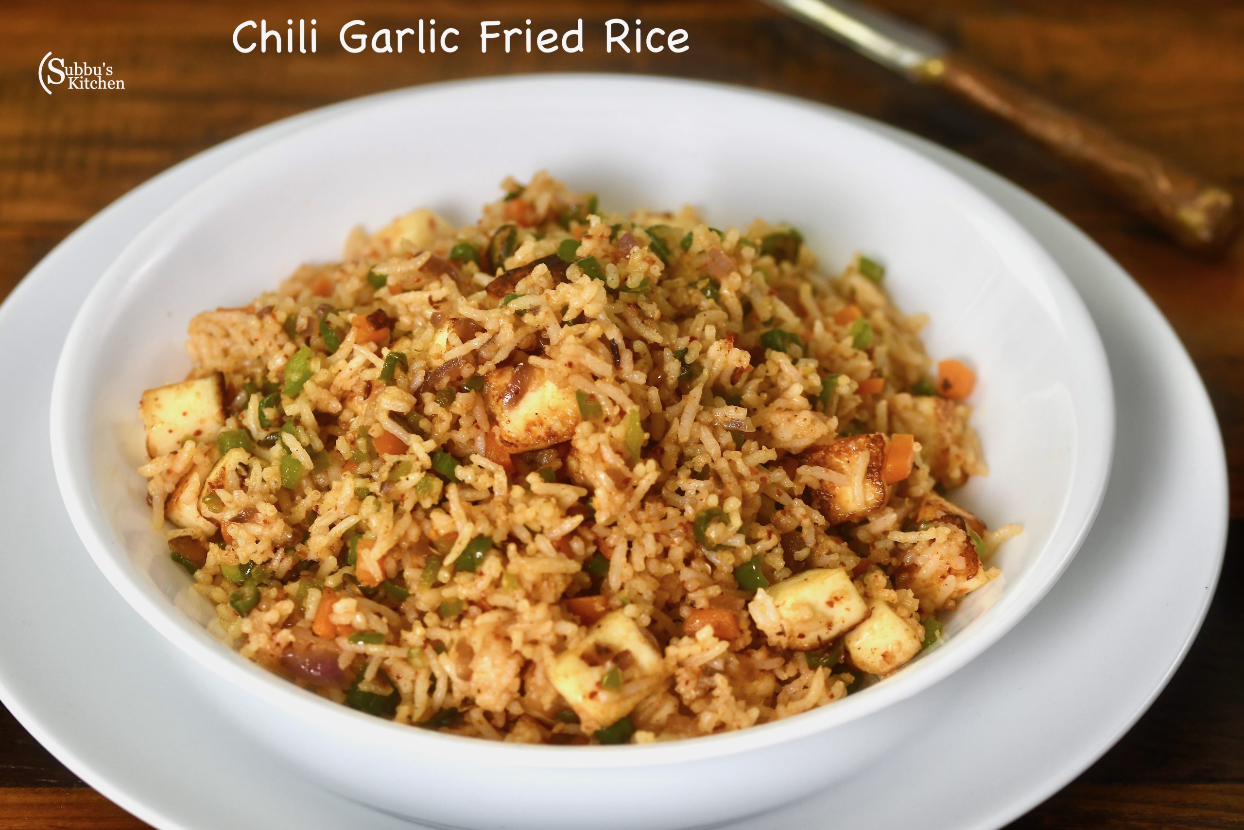 Spicy Chili Garlic Fried Rice with colorful vegetables and Paneer